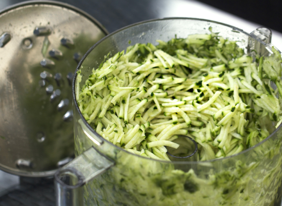 shredded zucchini in food processor |  www.4hourbodygirl.com