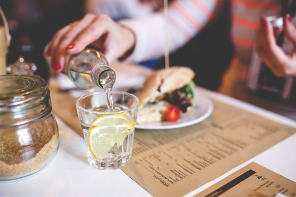 Water with lemon in glass | www.4hourbodygirl.com